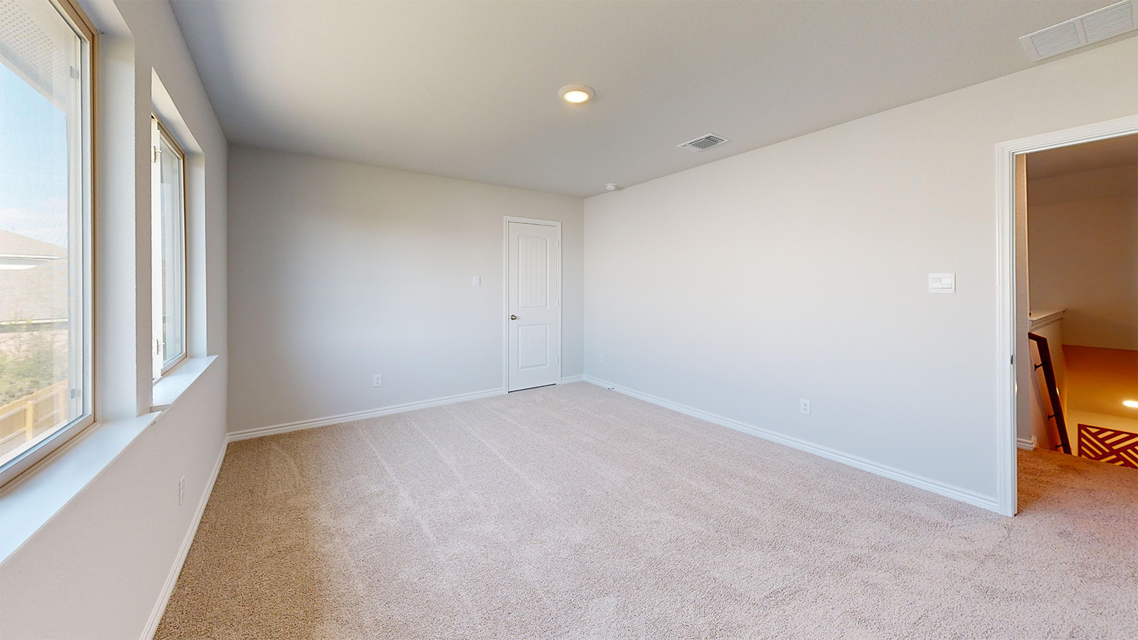 Newburgh secondary bedroom with carpeted flooring and window for lighting.