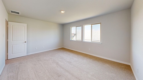 Newburgh secondary bedroom with carpeted flooring and window for lighting.