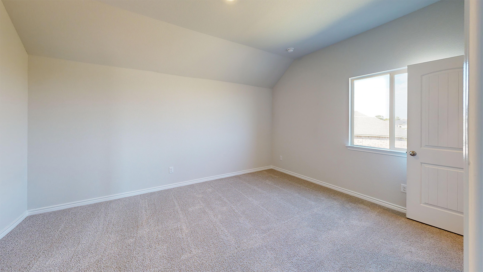 Newburgh secondary bedroom with carpeted flooring and window for lighting.