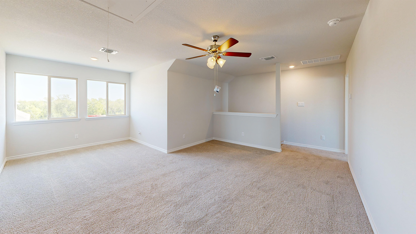 Newburgh game room with carpeted flooring and windows for lighting.