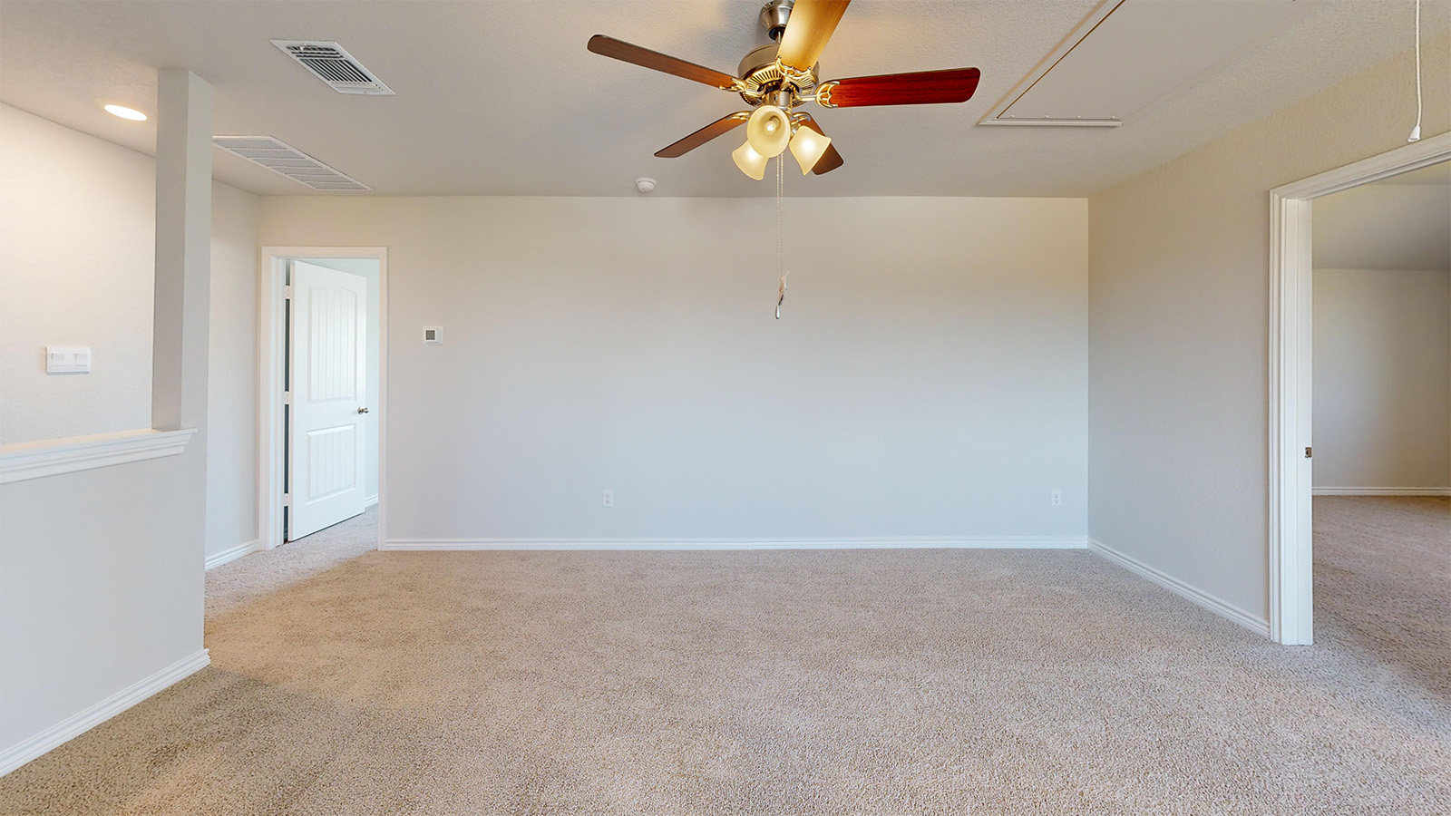 Newburgh game room with carpeted flooring and view of secondary bedrooms.