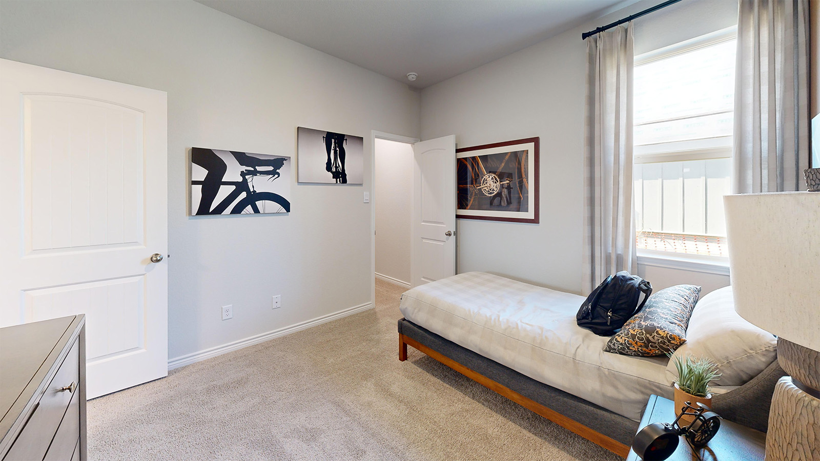 Newburgh secondary bedroom with carpeted flooring and window for lighting.