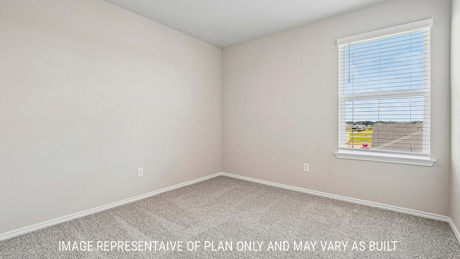 Prosper secondary bedroom with carpeted flooring and windows for natural lighting.