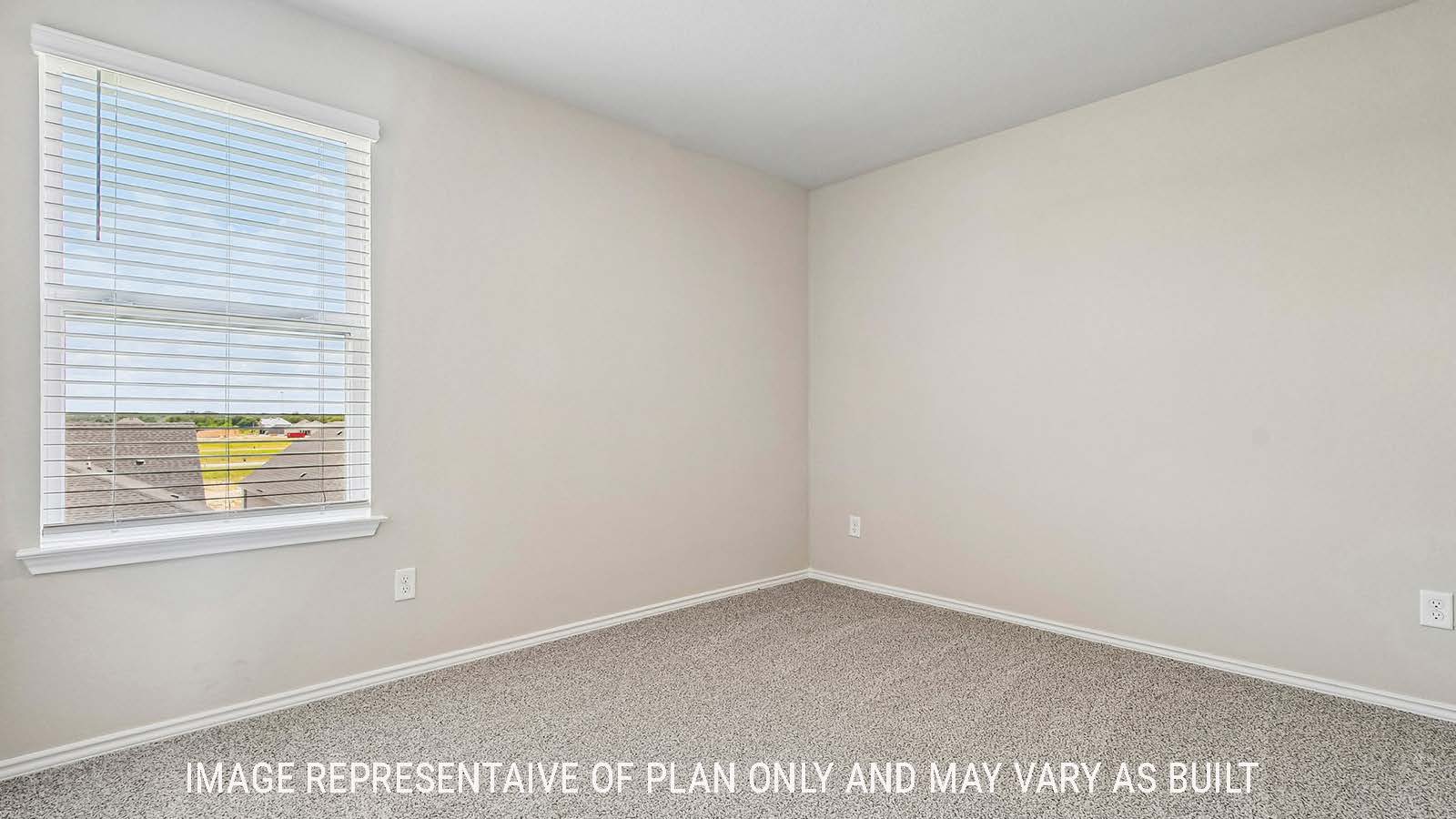 Prosper secondary bedroom with carpeted flooring and windows for natural lighting.