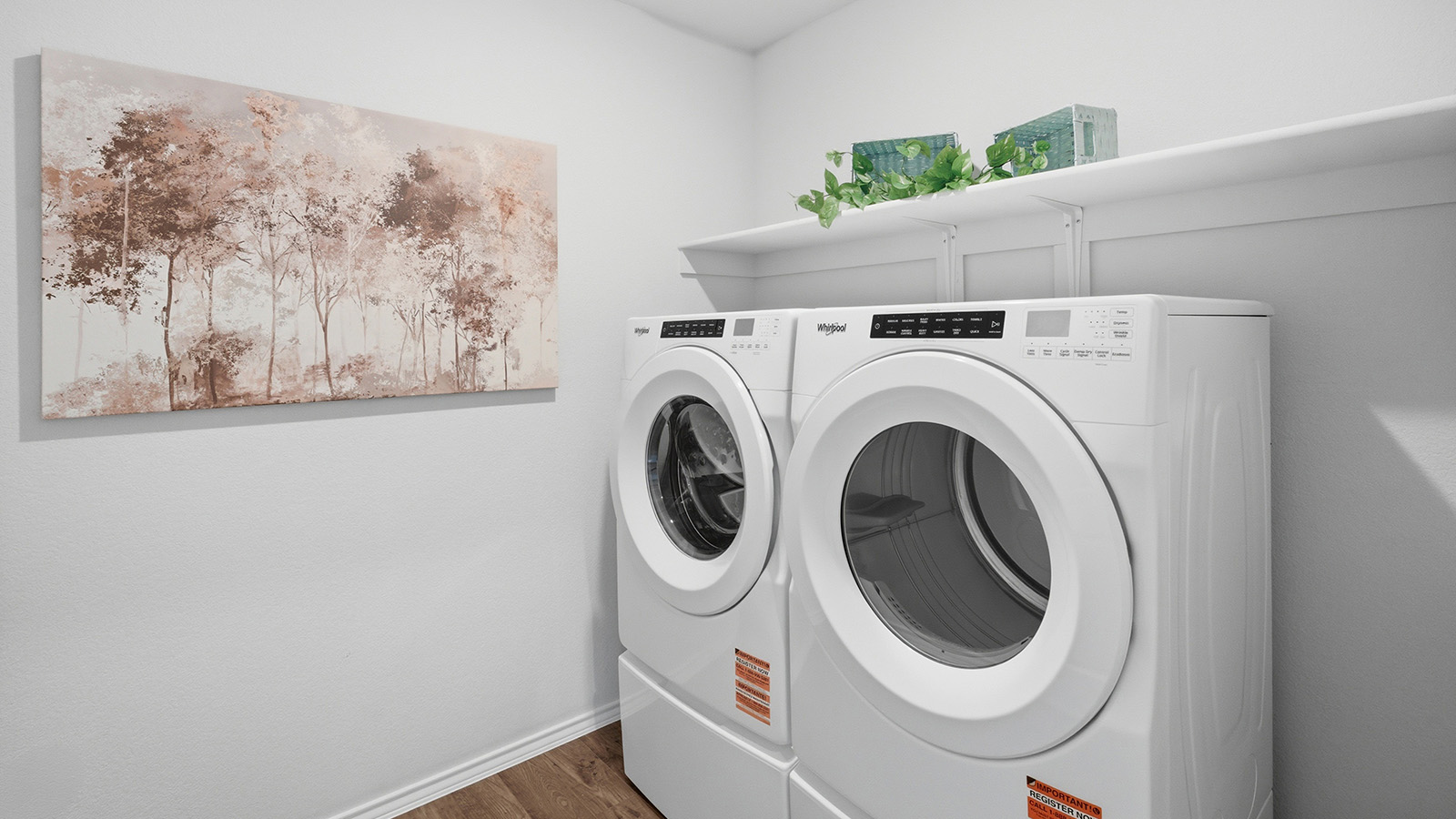 Eagles Landing Model Home utility room with washer and dryer and shelving for storage.