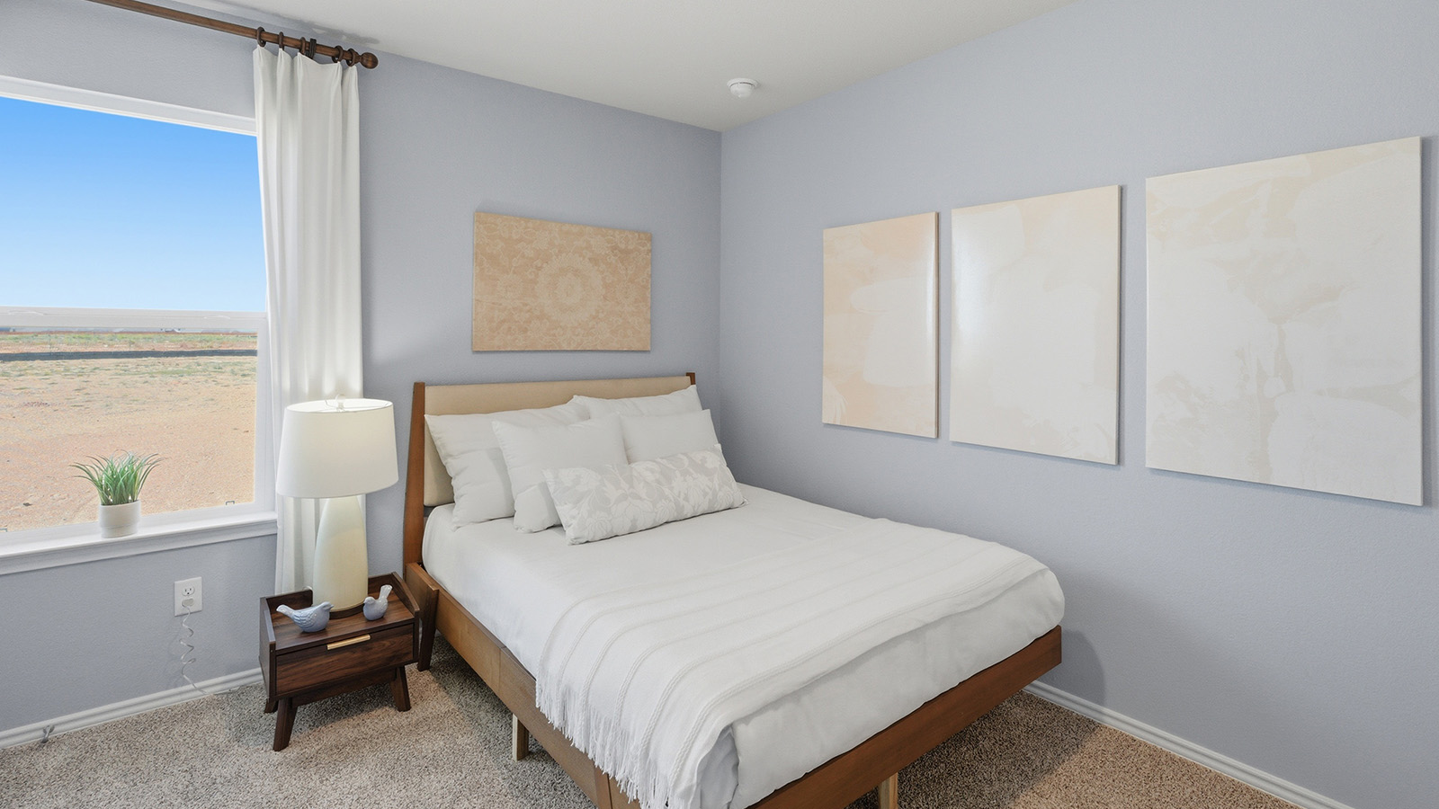 Eagles Landing Model Home secondary bedroom with carpeted flooring and window for lighting.