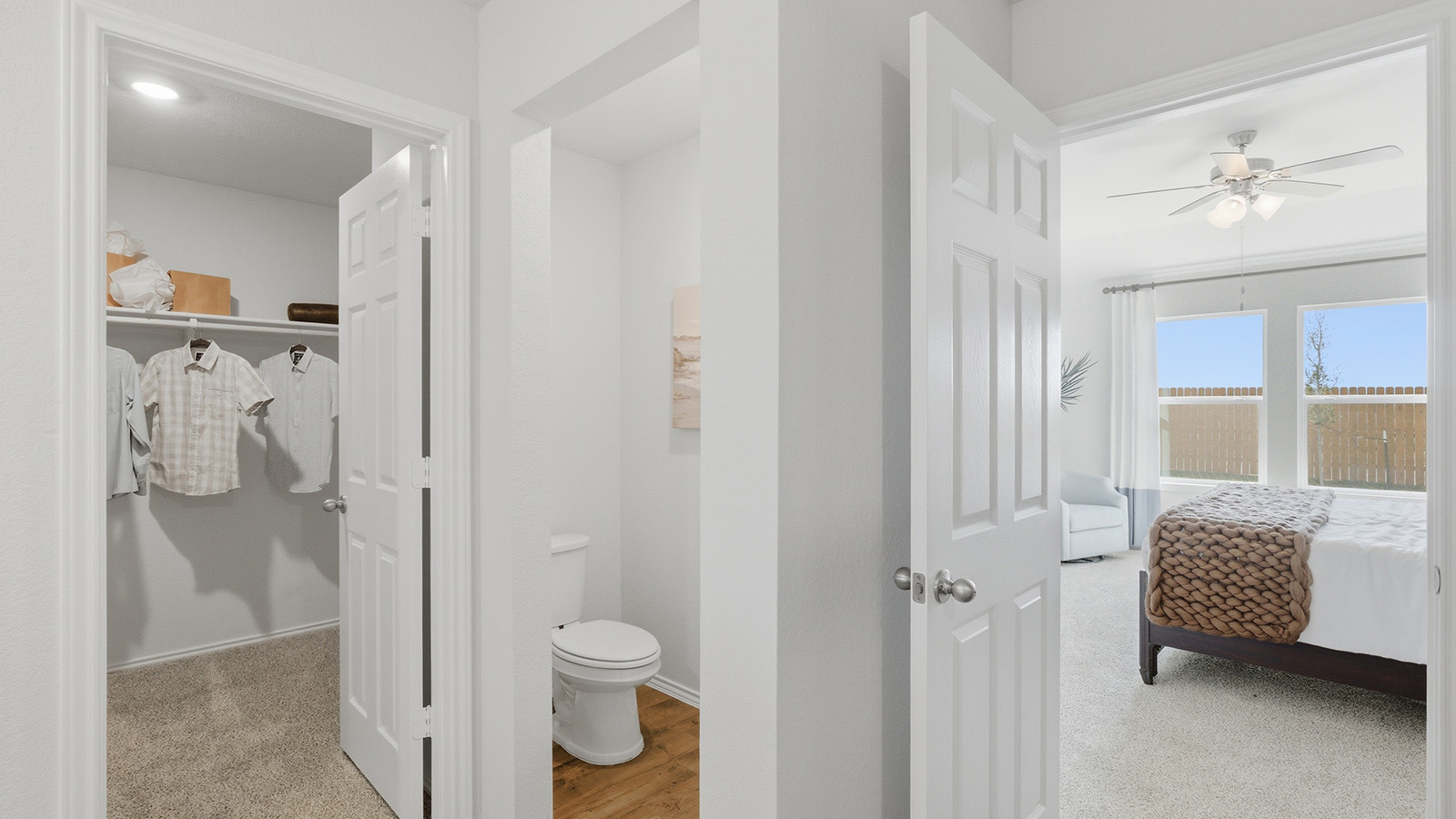 Eagles Landing Model Home primary bathroom with view of primary bedroom and primary walk-in closet.