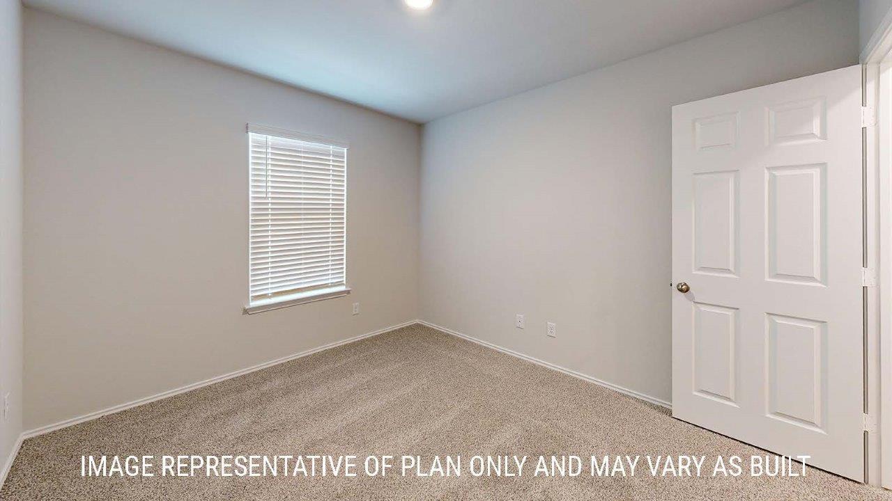 Emma secondary bedroom with carpeted flooring and window for lighting.