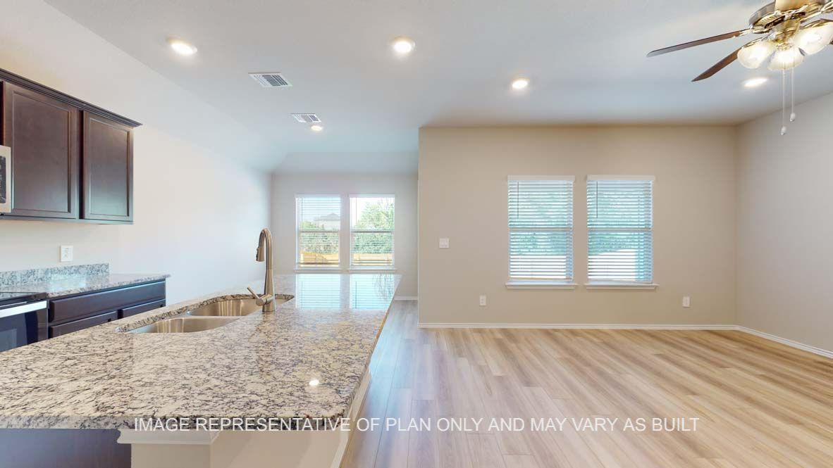 Bellvue open concept kitchen and living room with vinyl plank throughout.