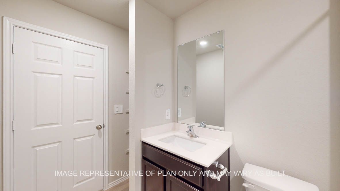 Texas Cali secondary bath with single vanity and mirror.