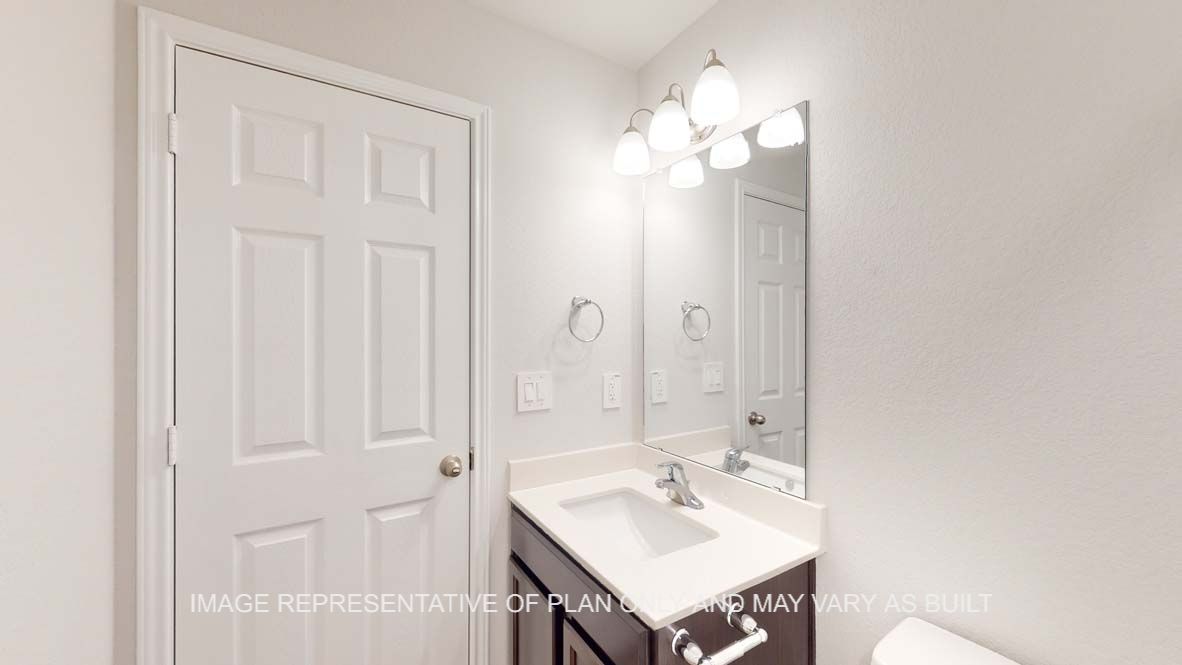 Roosevelt secondary bath with single vanity.