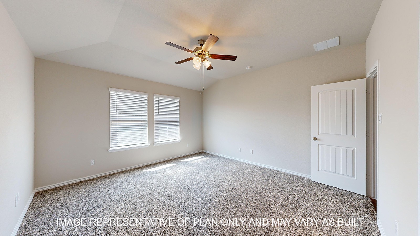 Monroe primary bedroom with carpet flooring and ceiling fan.