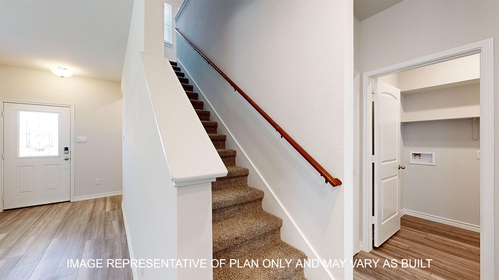 Sterling stairs with carpet flooring and handrail.