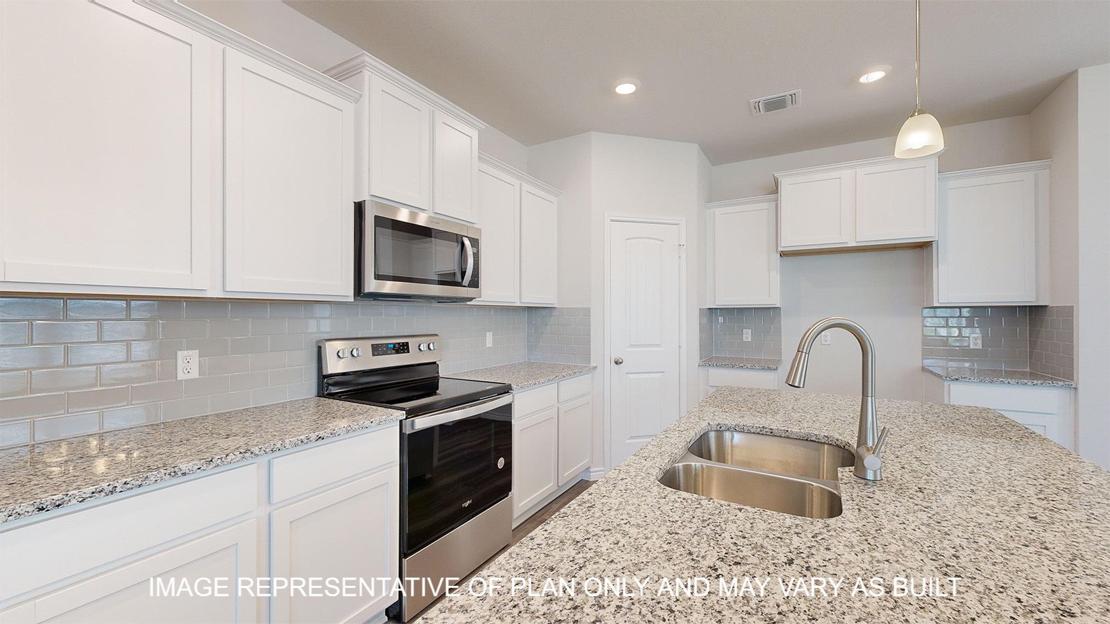 Sterling kitchen with white cabinets and granite countertops with stainless appliances.