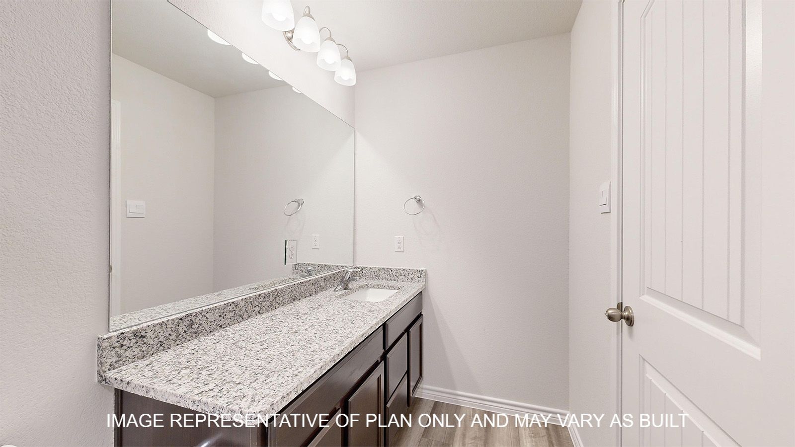 Sterling secondary bathroom with single vanity with extra countertop space.