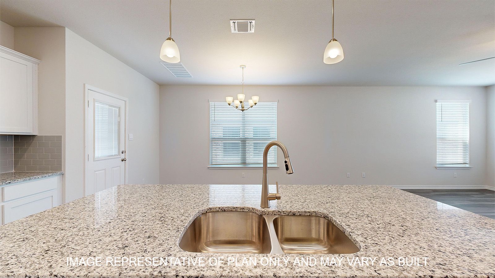 Sterling kitchen with large center kitchen island with undermount sink.