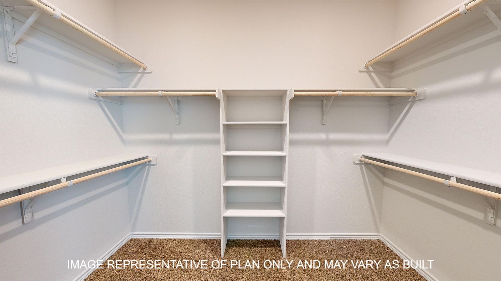 Sterling primary walk-in closet with carpet flooring and storage shelves and ample hanging space.