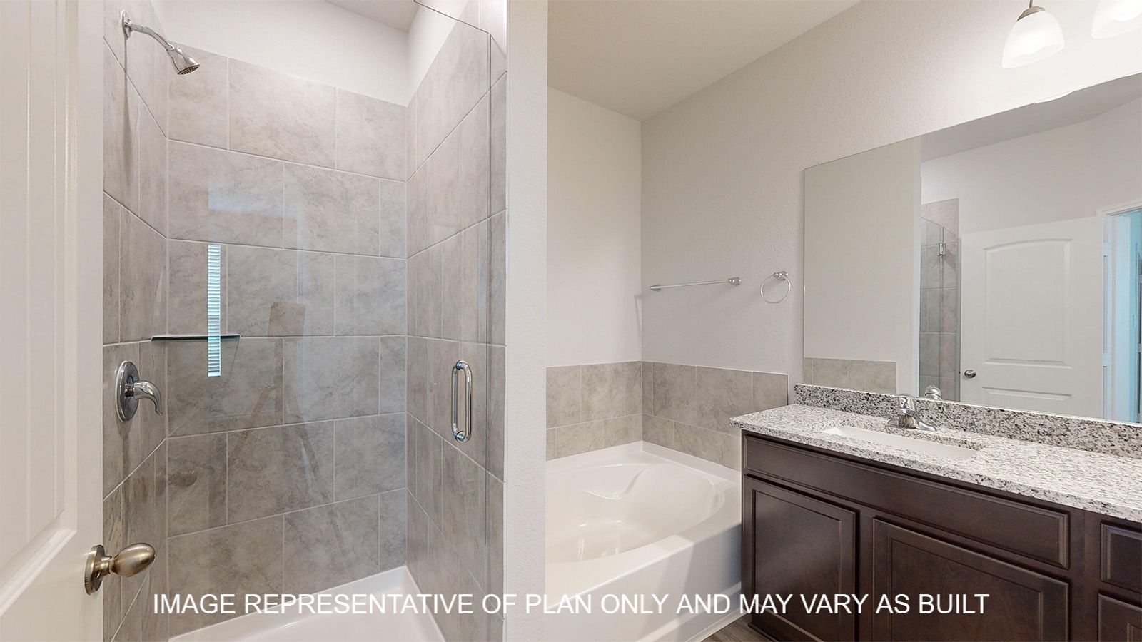 Sterling primary bathroom with separate tub and shower with ceramic tile surround.