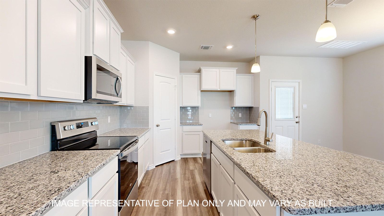 Sterling kitchen with vinyl plank flooring and white cabinets.