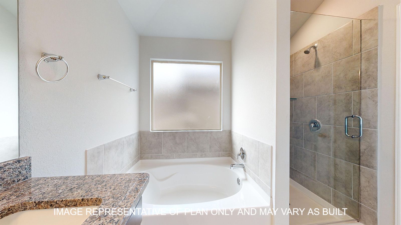 Magnolia primary bathroom with separate tub and shower with ceramic tile surround.