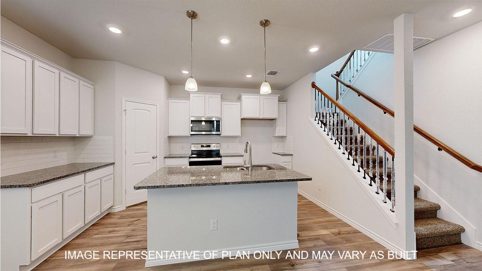 Magnolia kitchen with stair access to the second floor off the kitchen area.
