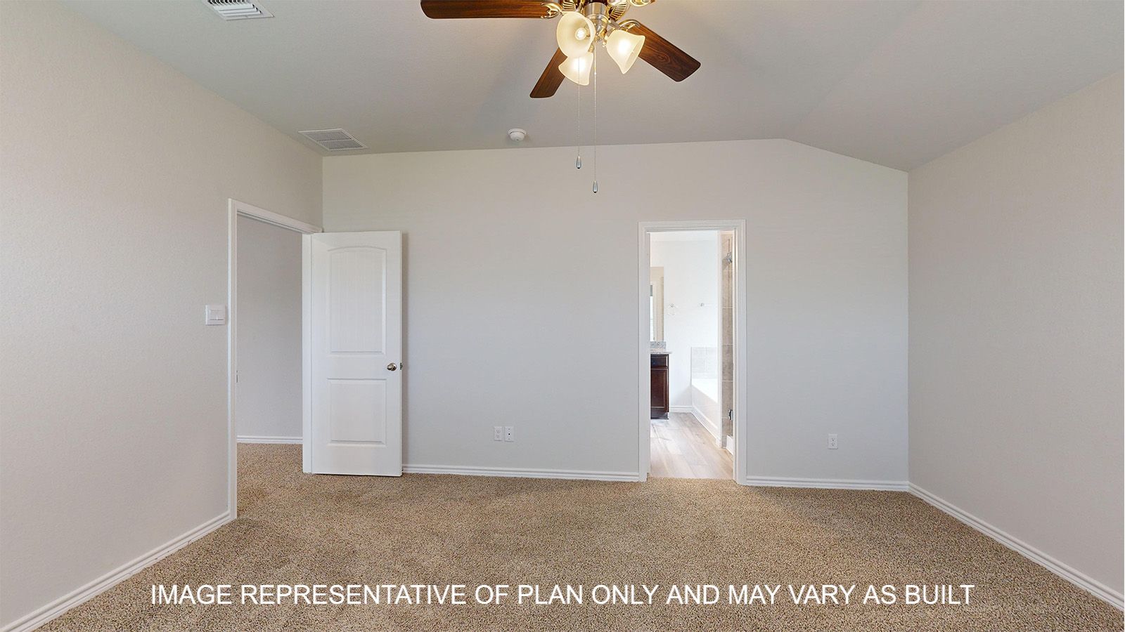 Magnolia primary bedroom with carpet flooring and access into primary bathroom.