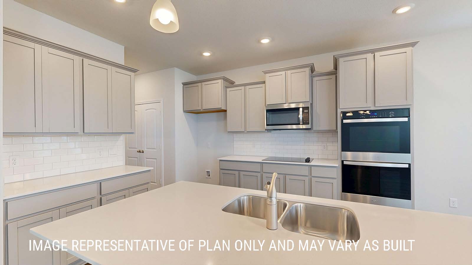 Sonoma kitchen with center kitchen island and light cabinets and granite countertops.