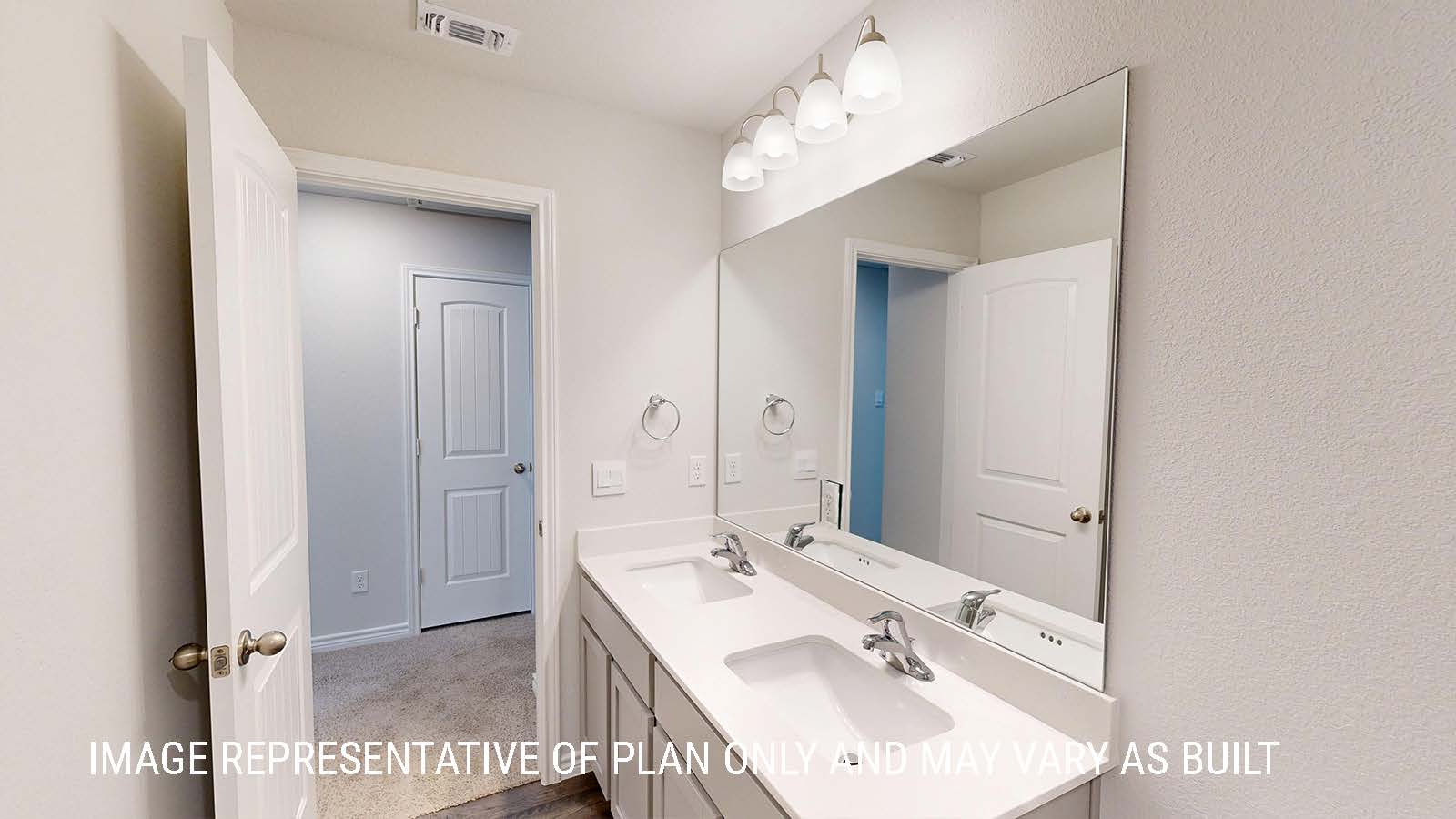 Sonoma secondary bathroom with duel vanity sink with light cabinets and granite countertops.