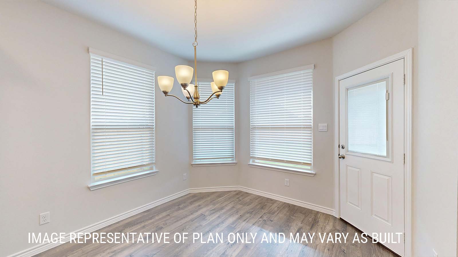 Sonoma dining room with view of back door and windows for lighting.