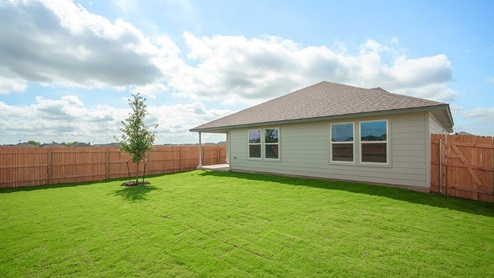 Mesa Ridge model home front exterior elevation with yard.