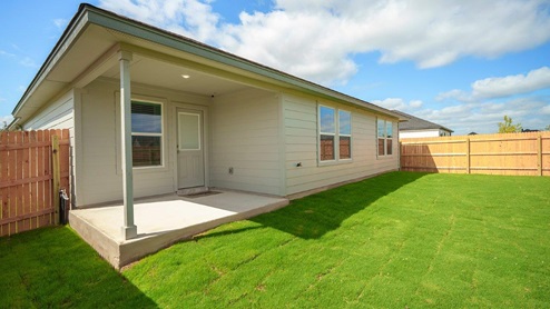 Mesa Ridge model home back exterior elevation with view of back door.