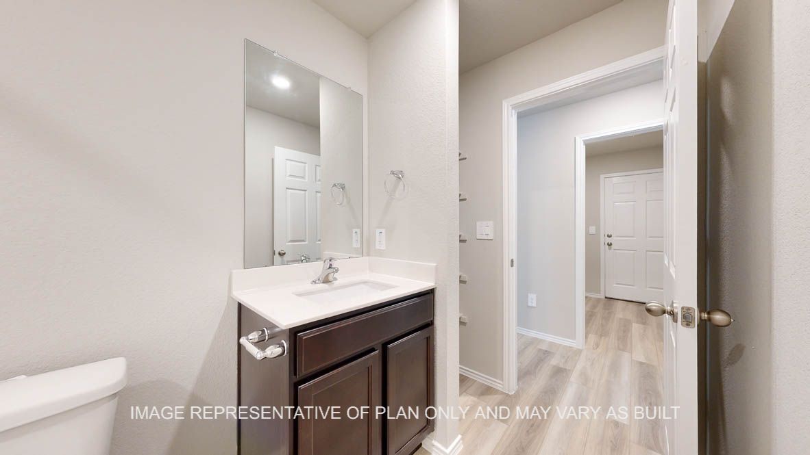 Seabrook secondary bath with dark cabinets and white countertops.