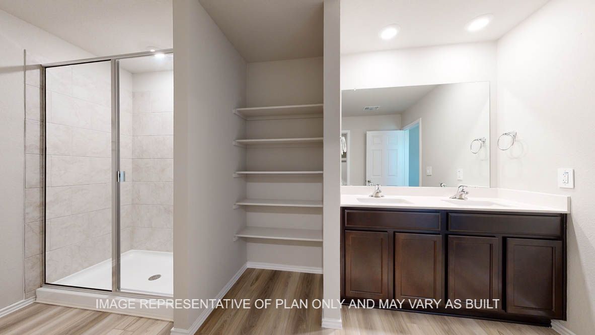 Seabrook primary bathroom with clear shower glass enclosure and ceramic tile surround at walk-in shower.