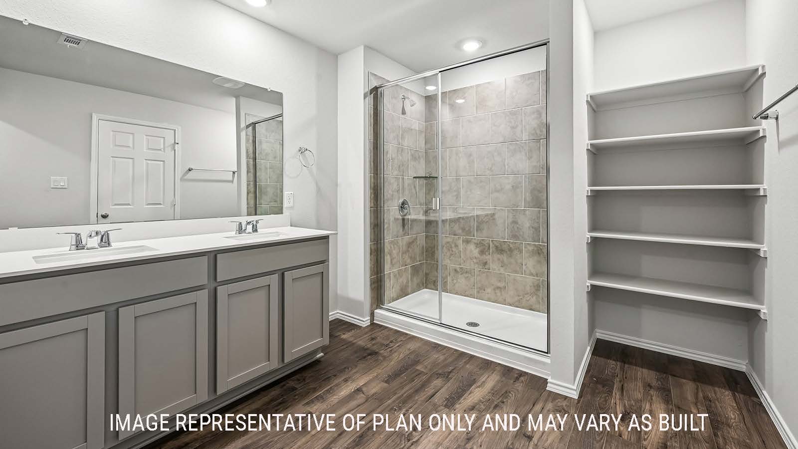 Madison primary bathroom with double vanity sink and walk-in shower.
