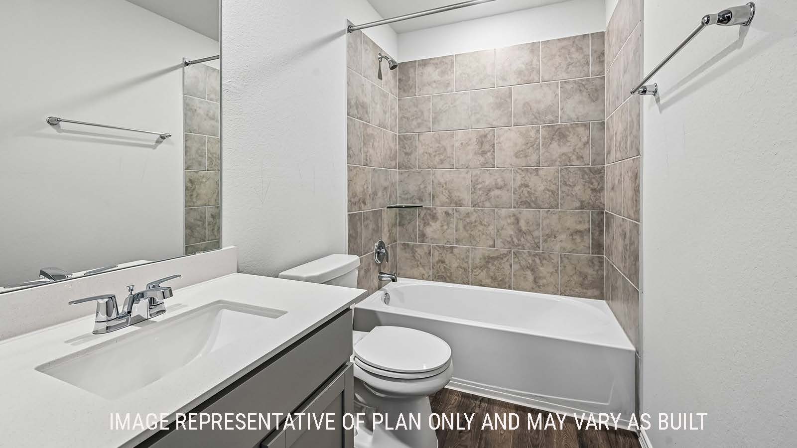 Madison secondary bathroom with vanity sink and shower and tub combo.
