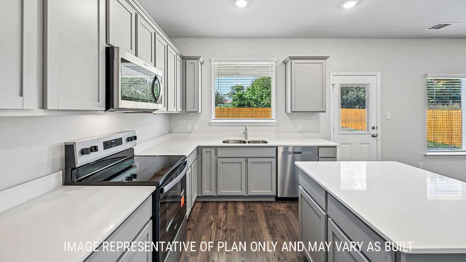 Madison kitchen with kitchen island and light cabinets with window for natural lighting.