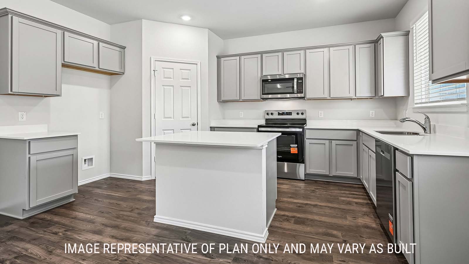 Madison kitchen with kitchen island and light cabinets with window for natural lighting.