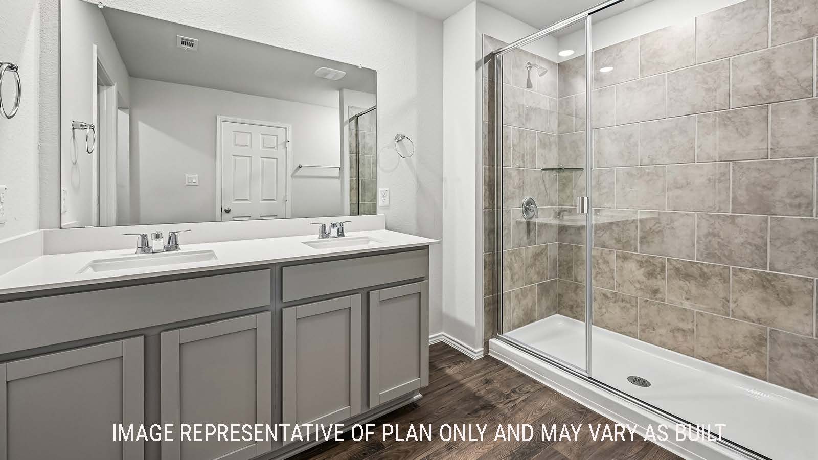 Madison primary bathroom with double vanity sink and walk-in shower.