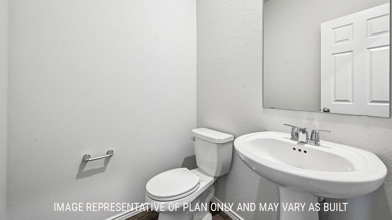 Madison half bath with sink and mirror.