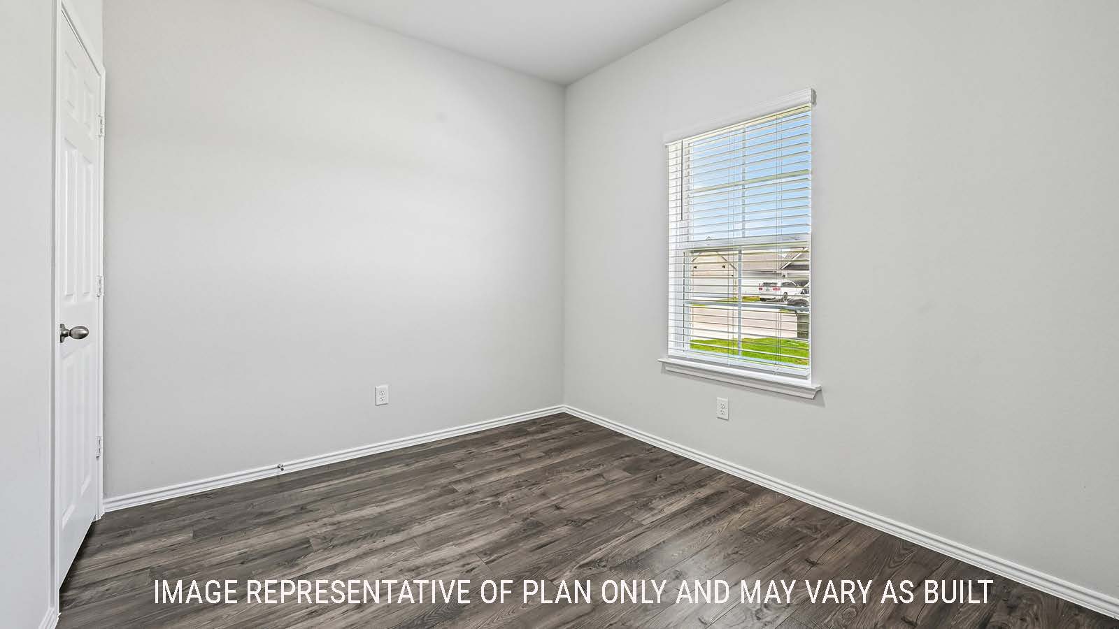 Madison study with vinyl flooring and window for natural lighting.