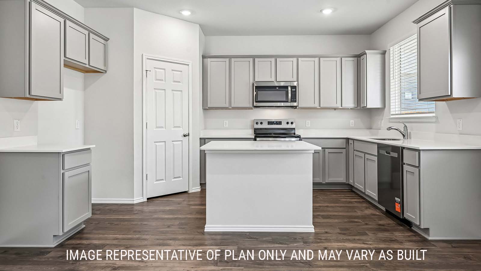 Madison kitchen with kitchen island and light cabinets with window for natural lighting.