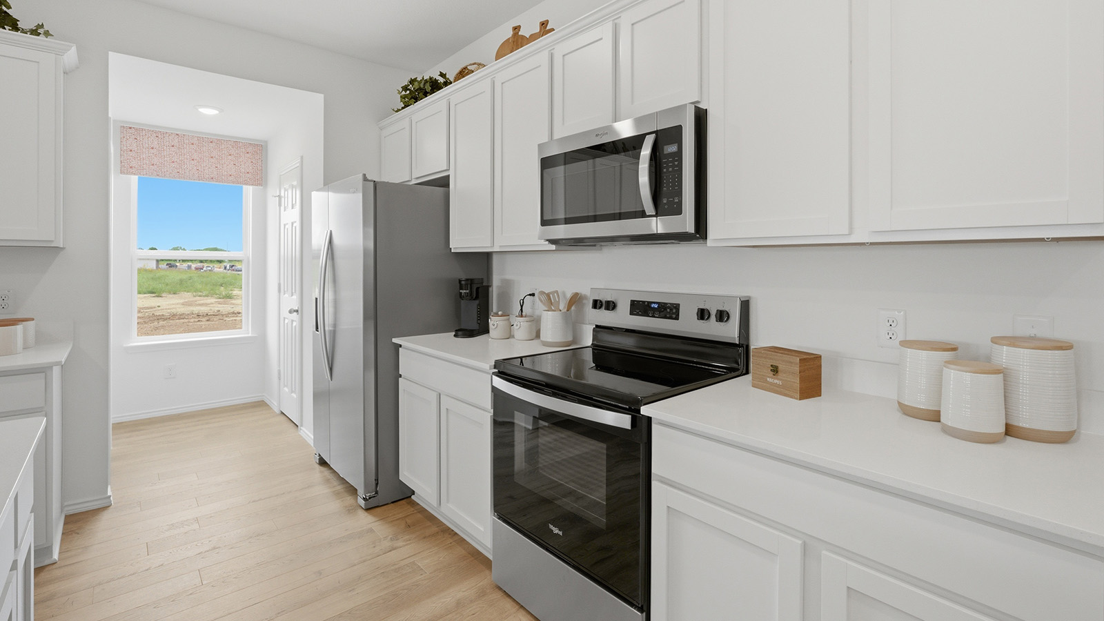 Ranch San Gabriel kitchen with white cabinets and granite countertops.