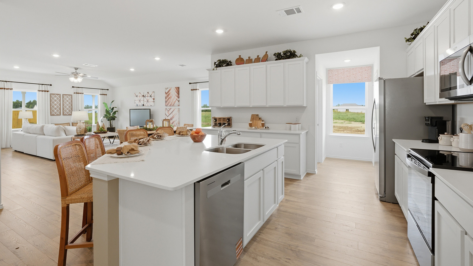 Ranch San Gabriel kitchen with kitchen island with granite countertops and view of open concept dining room and living room.