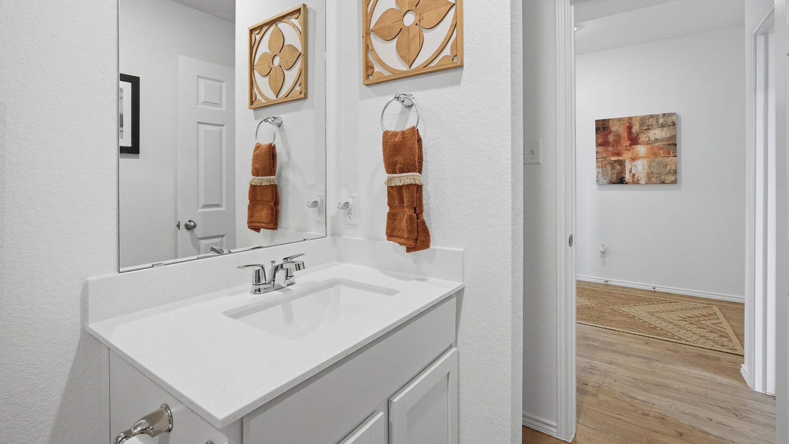 Ranch San Gabriel secondary bathroom with vanity sink and view of hallway.