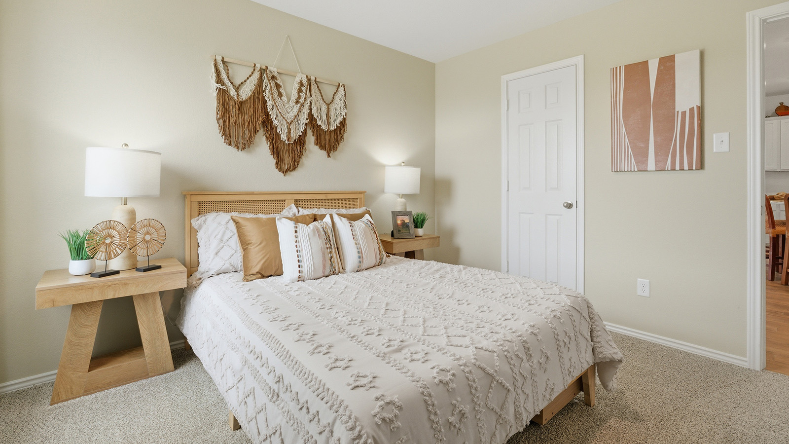 Ranch San Gabriel secondary bedroom with carpeted flooring and view of open concept living room.