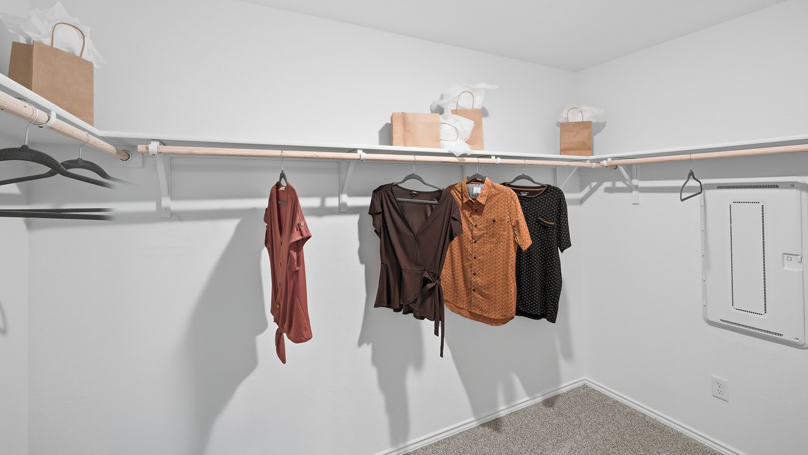 Ranch San Gabriel primary bedroom closet with carpeted flooring and shelving for storage.