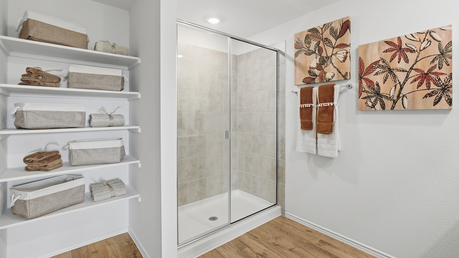 Ranch San Gabriel primary bathroom with walk-in shower and shelving for storage.