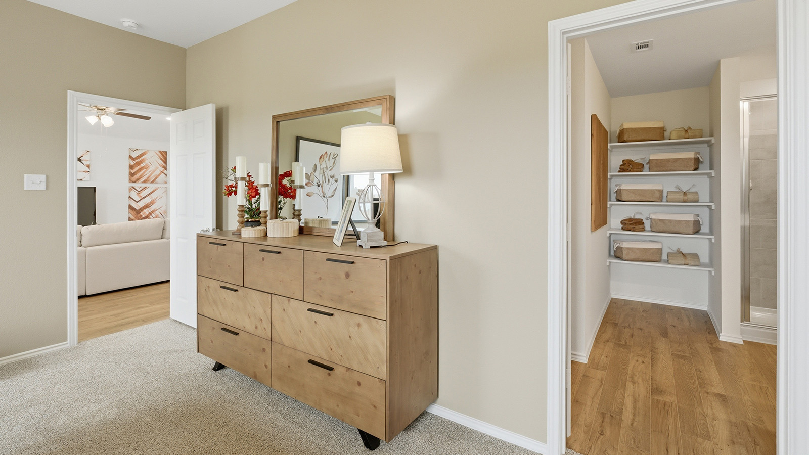 Ranch San Gabriel primary bedroom with carpeted flooring and view of primary bathroom.