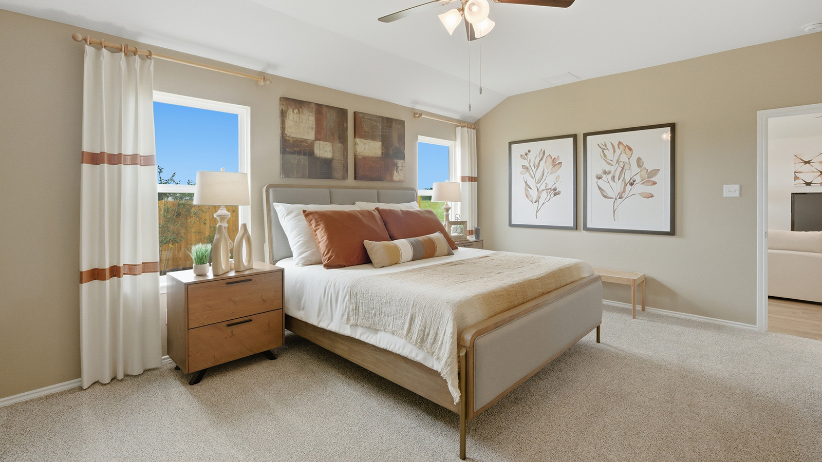 Ranch San Gabriel primary bedroom with carpeted flooring and windows for natural lighting.