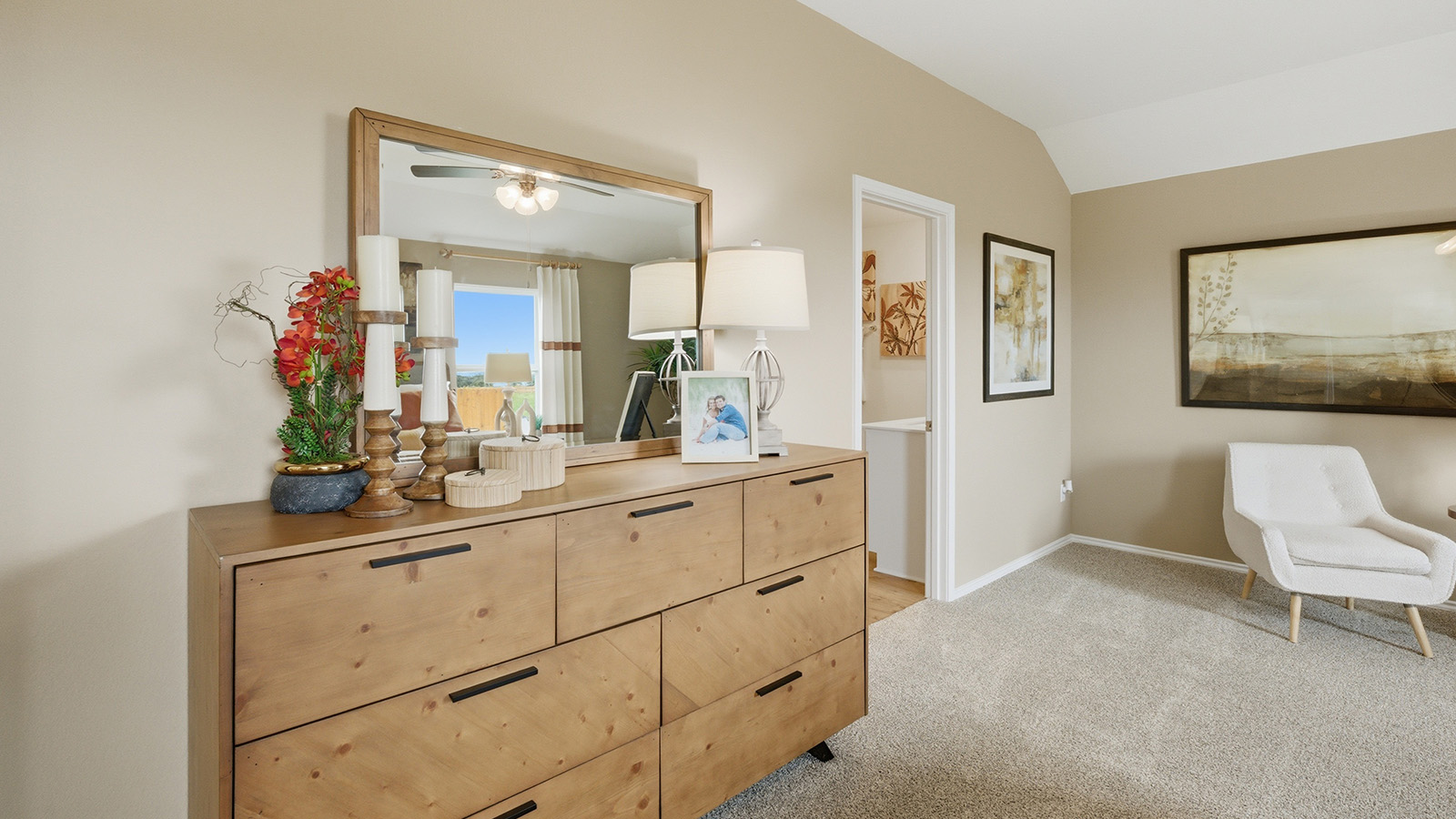 Ranch San Gabriel primary bedroom with carpeted flooring and view of primary bathroom.